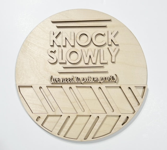 Knock Slowly We Have To Put Pants On Round Doorhanger