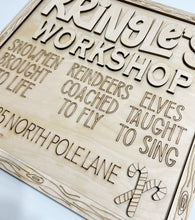 Kringle's Workshop Christmas North Pole Lane Square Doorhanger
