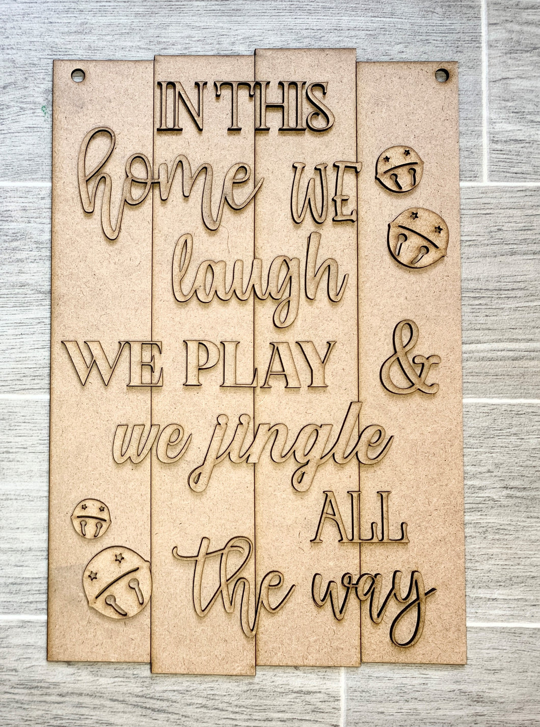 In This Home We Laugh We Play We Jingle All the Way Vertical Rectangle Doorhanger